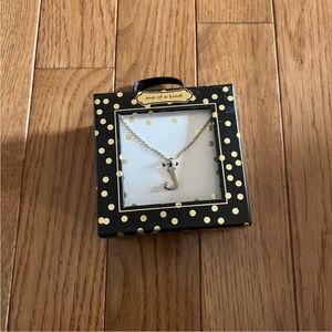 One of a Kind “ J” initial necklace . New . Sealed . Never worn.